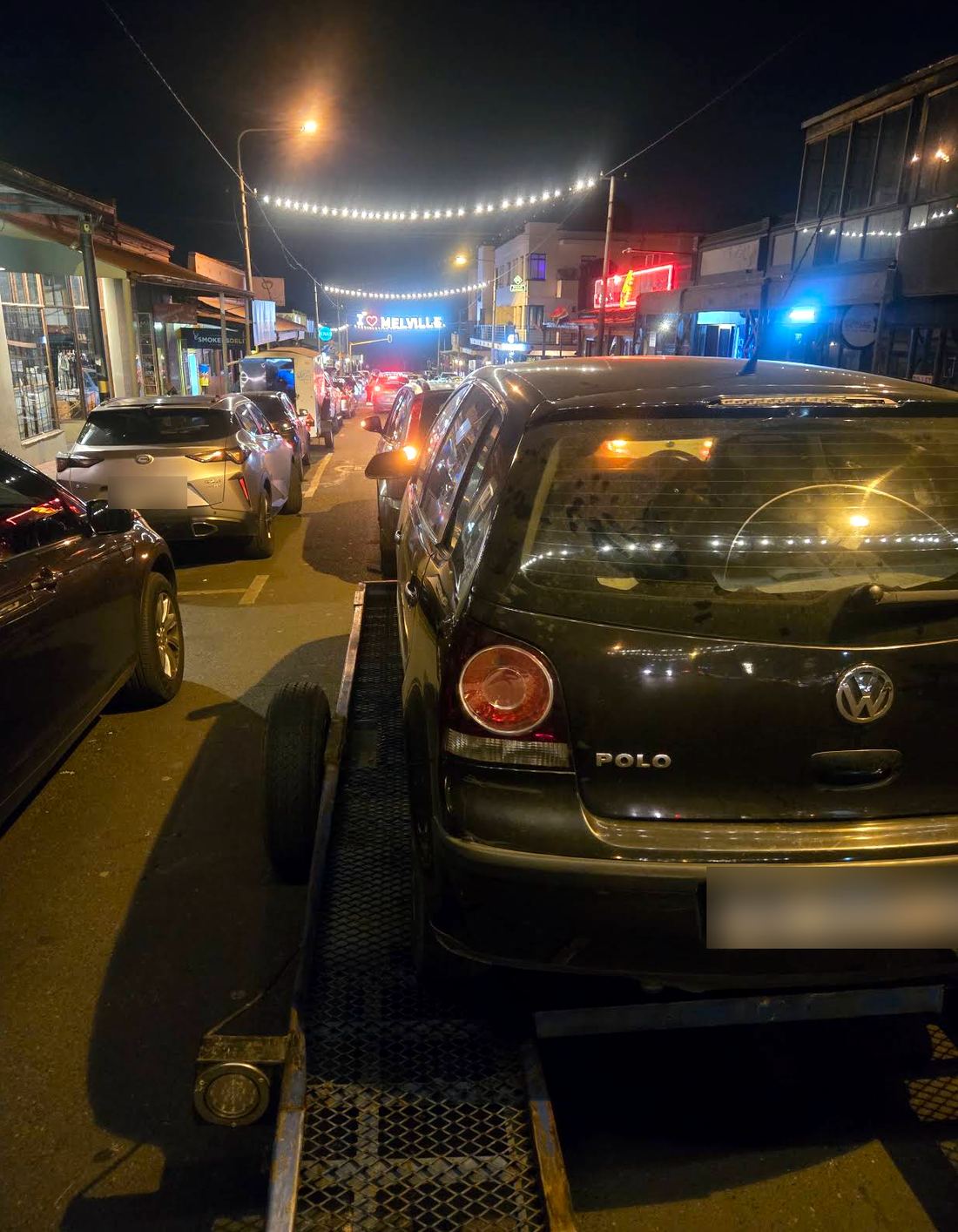 Arnold's trailer collecting a VW Polo at night in Melville